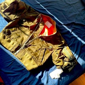 The color is foggy green on the out side ,but orange in side . Summer jacket